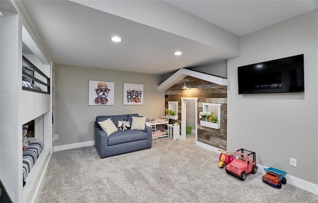 game room with wood walls and carpet flooring