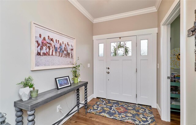 entryway featuring hardwood / wood-style floors and ornamental molding