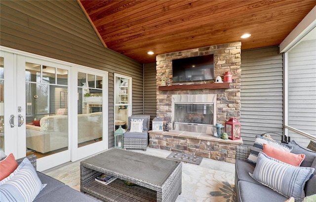 view of patio with an outdoor stone fireplace