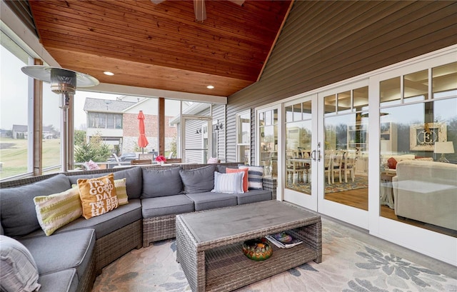 sunroom with lofted ceiling, wood ceiling, and french doors