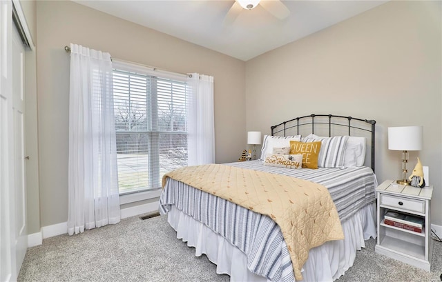 carpeted bedroom with ceiling fan