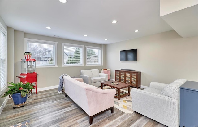 living room with light hardwood / wood-style floors