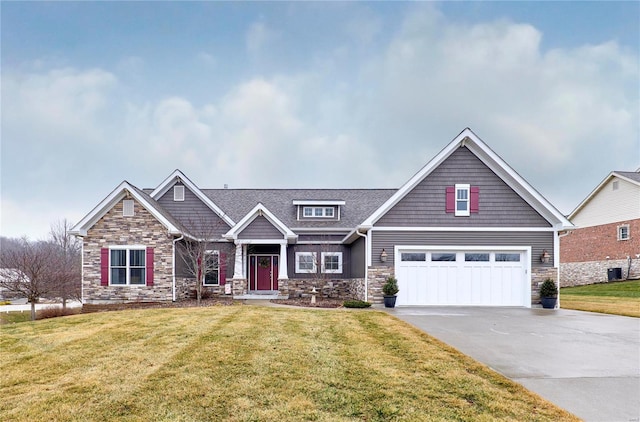 craftsman-style home featuring a garage, central air condition unit, and a front lawn