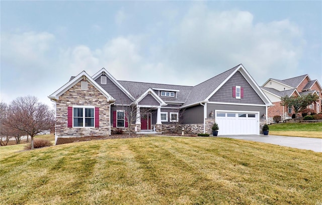 craftsman-style house featuring a garage and a front yard