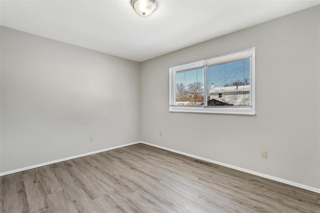 unfurnished room featuring light wood-type flooring