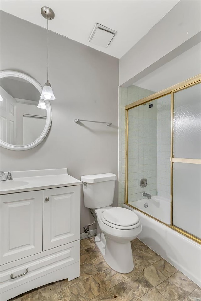 full bathroom with shower / bath combination with glass door, vanity, and toilet