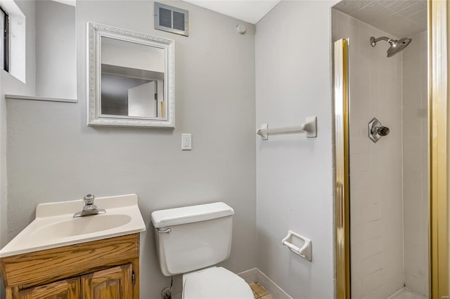 bathroom with vanity, toilet, and a shower with door