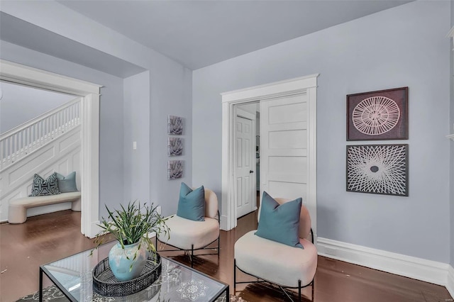 sitting room with wood finished floors and baseboards