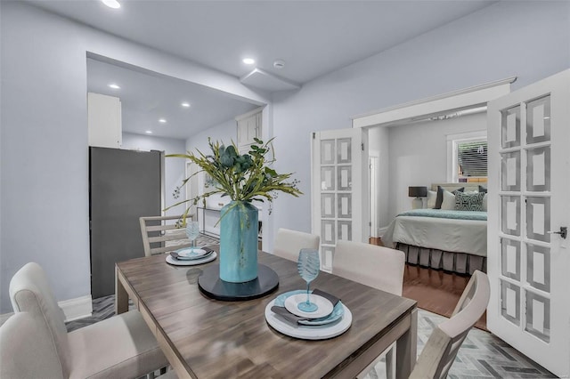 dining space featuring recessed lighting