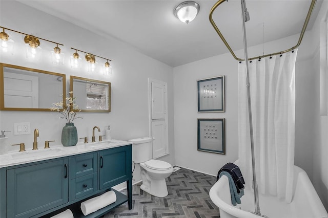 full bath with a shower with shower curtain, double vanity, a sink, and toilet