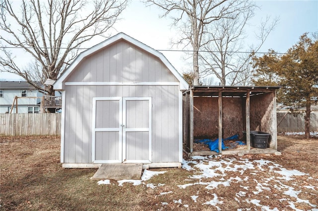 view of shed with fence