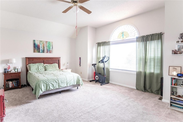 carpeted bedroom featuring a ceiling fan and baseboards