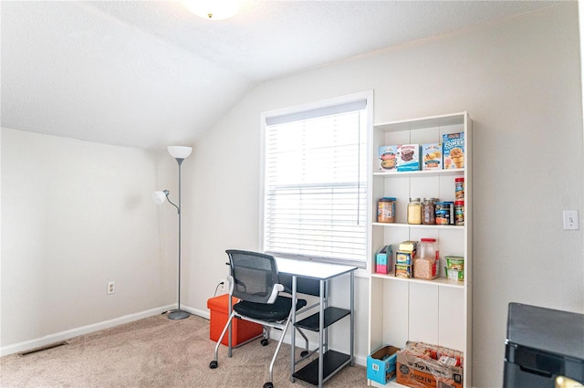 home office with baseboards, visible vents, lofted ceiling, a textured ceiling, and carpet floors