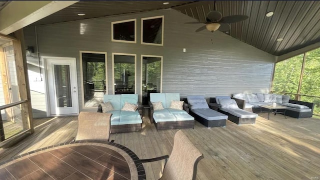 deck with an outdoor hangout area and ceiling fan