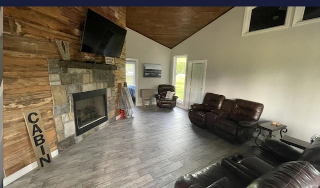 living room with a fireplace and vaulted ceiling