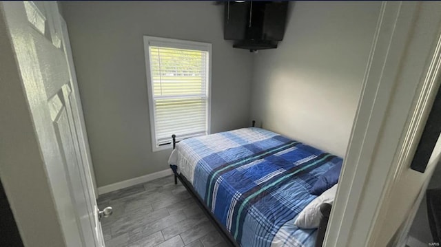 bedroom featuring hardwood / wood-style flooring