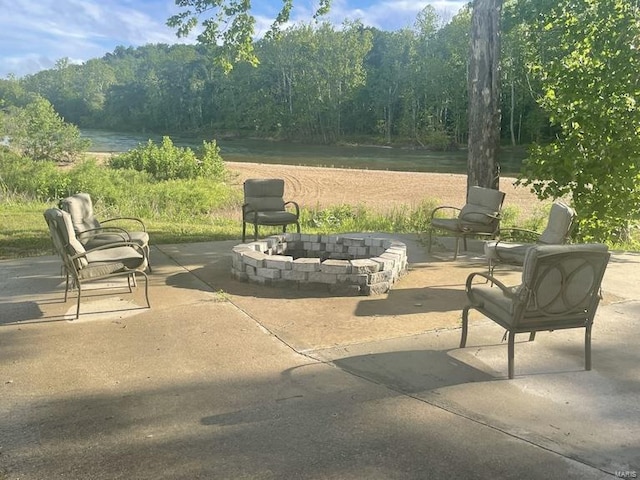 view of patio / terrace with an outdoor fire pit