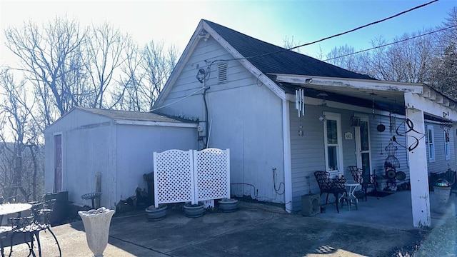 view of property exterior featuring covered porch