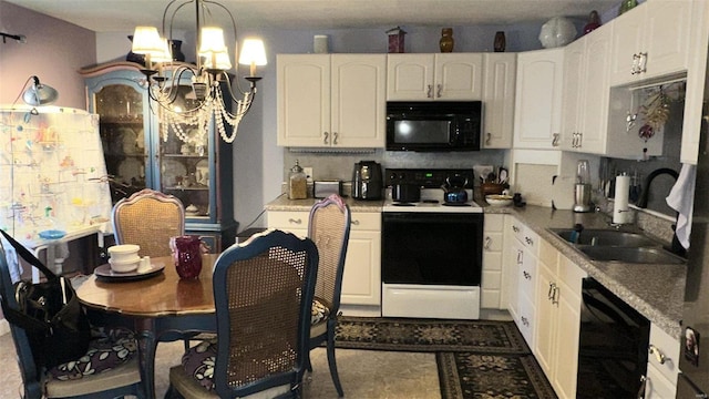 kitchen featuring pendant lighting, black appliances, white cabinets, sink, and a notable chandelier