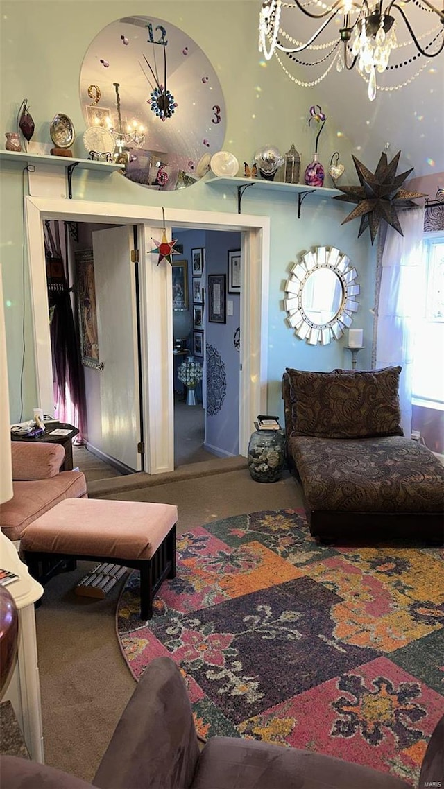 living room with carpet flooring and a chandelier