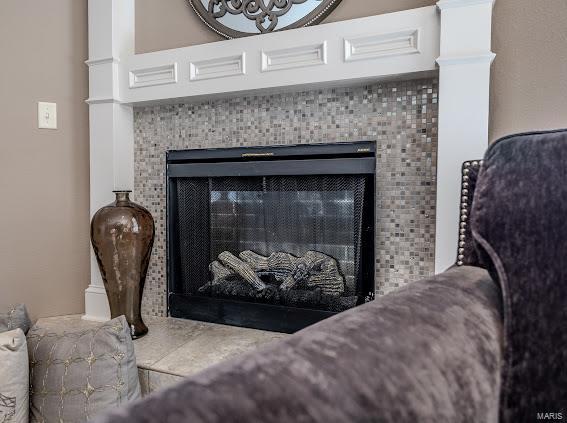 details featuring a tile fireplace