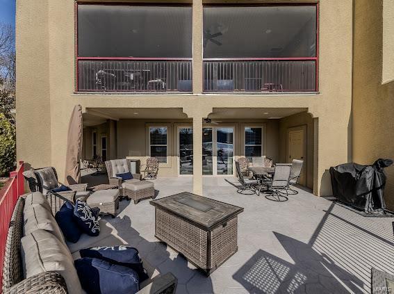 view of patio / terrace featuring an outdoor living space and a balcony