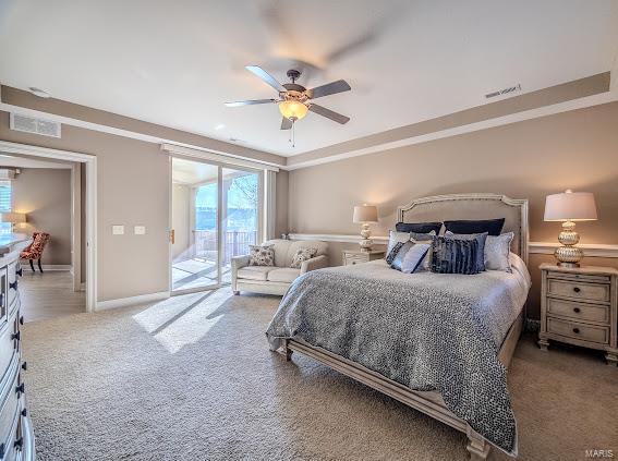 bedroom featuring carpet flooring, ceiling fan, and access to outside