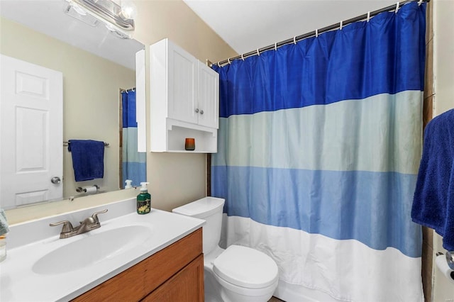 bathroom with toilet and vanity