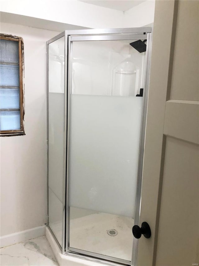 bathroom featuring an enclosed shower