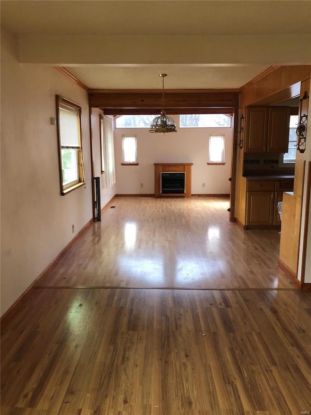 unfurnished living room featuring hardwood / wood-style floors