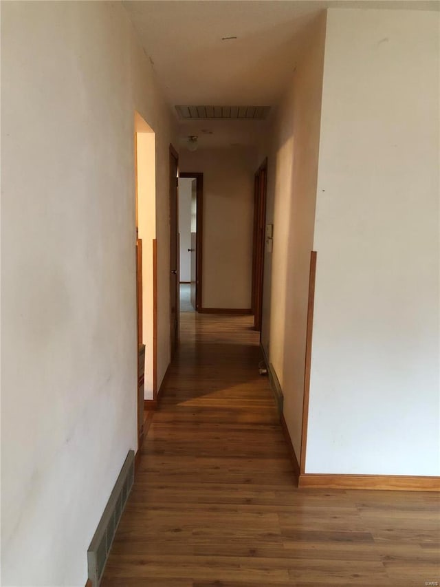 hallway featuring dark hardwood / wood-style floors