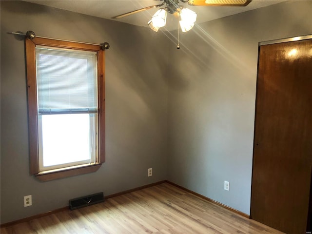 unfurnished room featuring ceiling fan and light hardwood / wood-style flooring