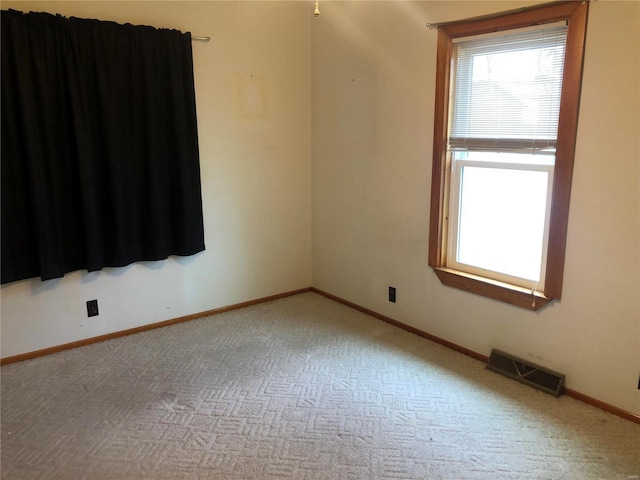 unfurnished room with carpet flooring