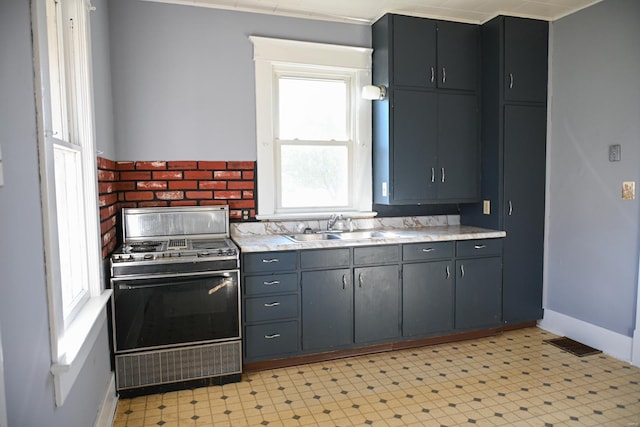 kitchen featuring range and sink