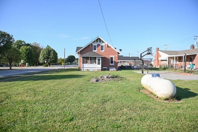 back of property featuring a lawn