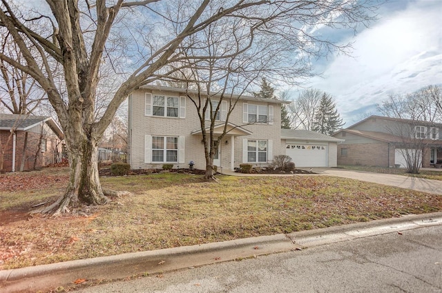 view of front facade with a front yard and a garage