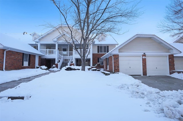 view of front of property featuring a porch and a garage