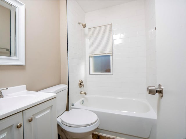 full bathroom featuring toilet, vanity, and tiled shower / bath combo