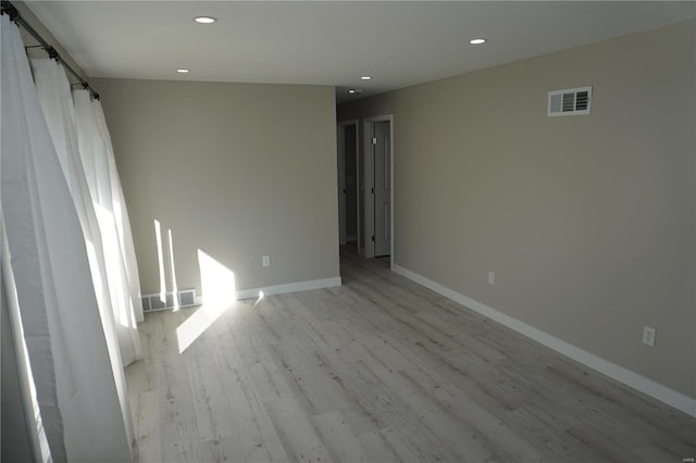 unfurnished room featuring light wood-type flooring