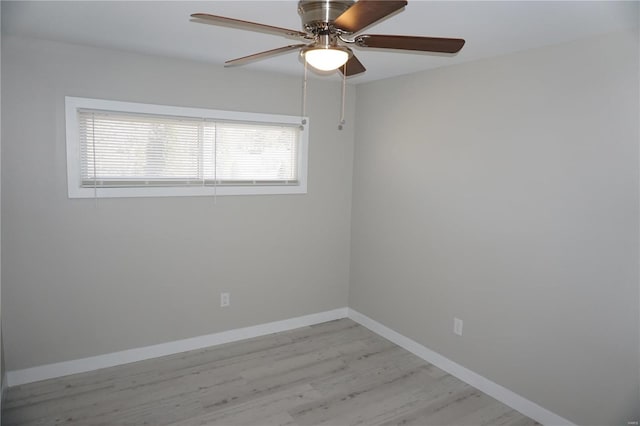 empty room with ceiling fan and light hardwood / wood-style floors