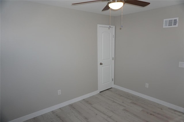 empty room featuring light wood-type flooring and ceiling fan