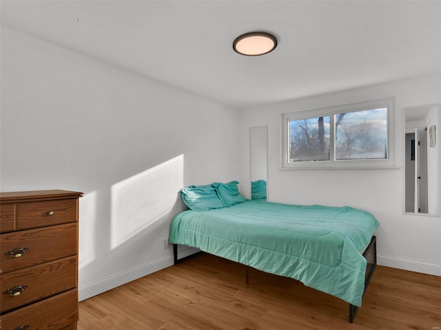 bedroom with wood-type flooring