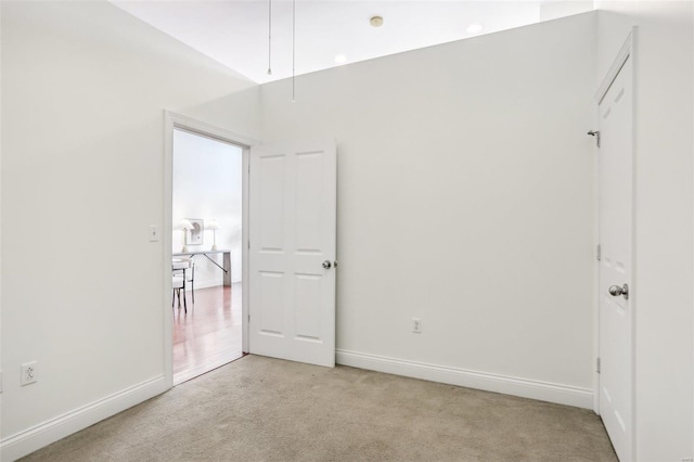 empty room with light colored carpet