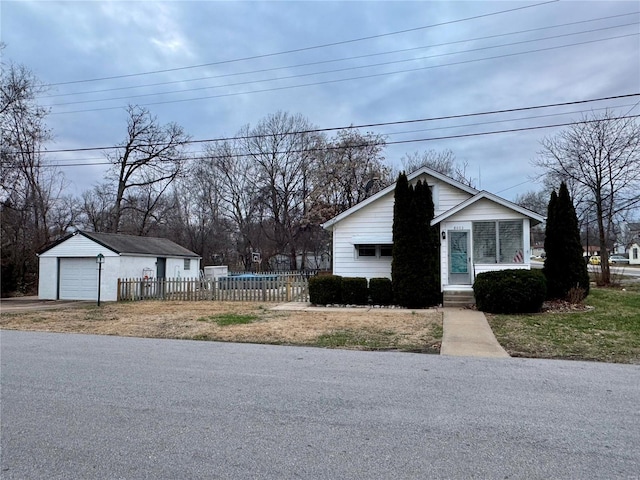 view of property exterior featuring a garage and an outdoor structure