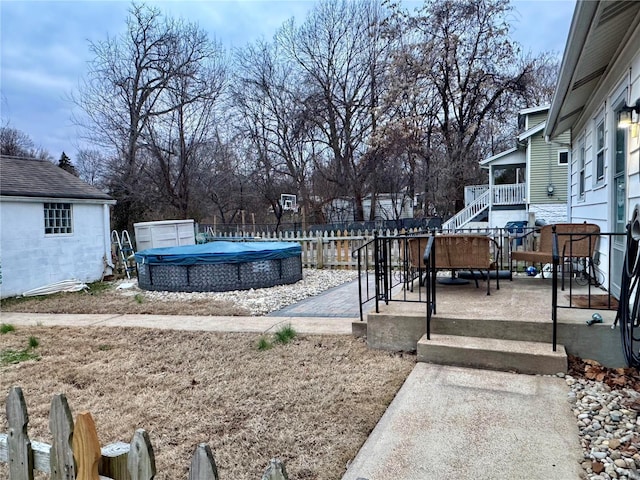 view of yard with a covered pool