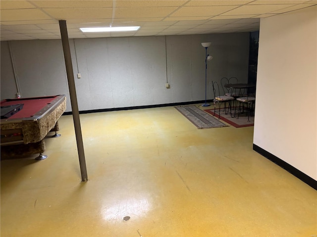 basement featuring a drop ceiling and pool table