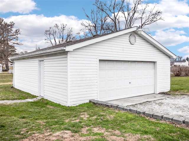 garage featuring a yard