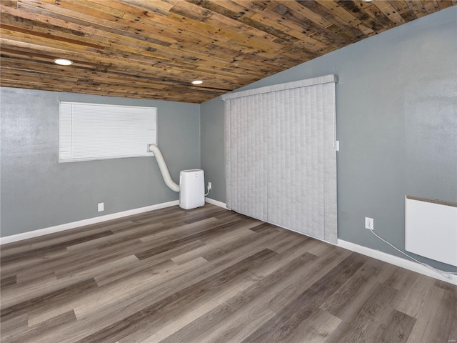 interior space with dark hardwood / wood-style floors and wood ceiling