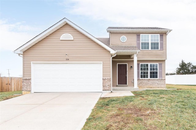 front of property featuring a garage and a front lawn