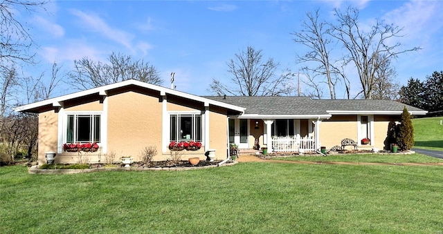 ranch-style house with covered porch and a front lawn